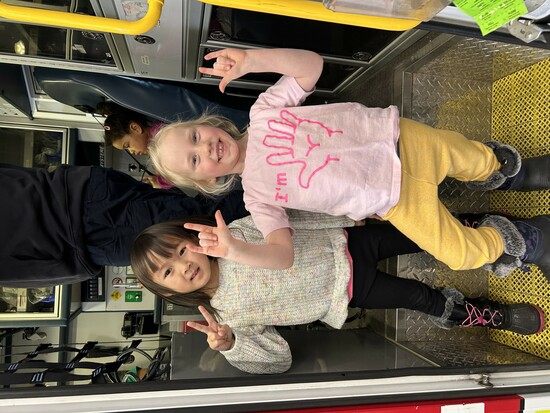 Kindergarten children posing on a fire truck